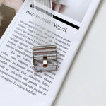Candy color transparent TPU watchband for Apple Watch with silver buckle on magazine background.