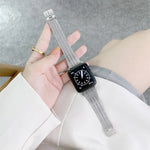 Steel replacement strap for Apple Watch displayed on wrist with modern watch face.