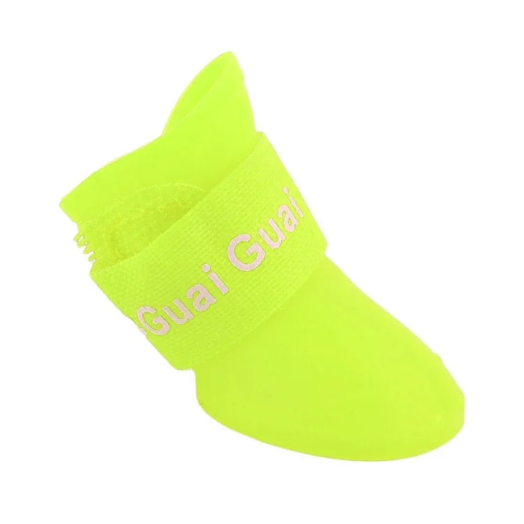 Waterproof rubber dog shoes in bright yellow color with adjustable strap for easy wear.
